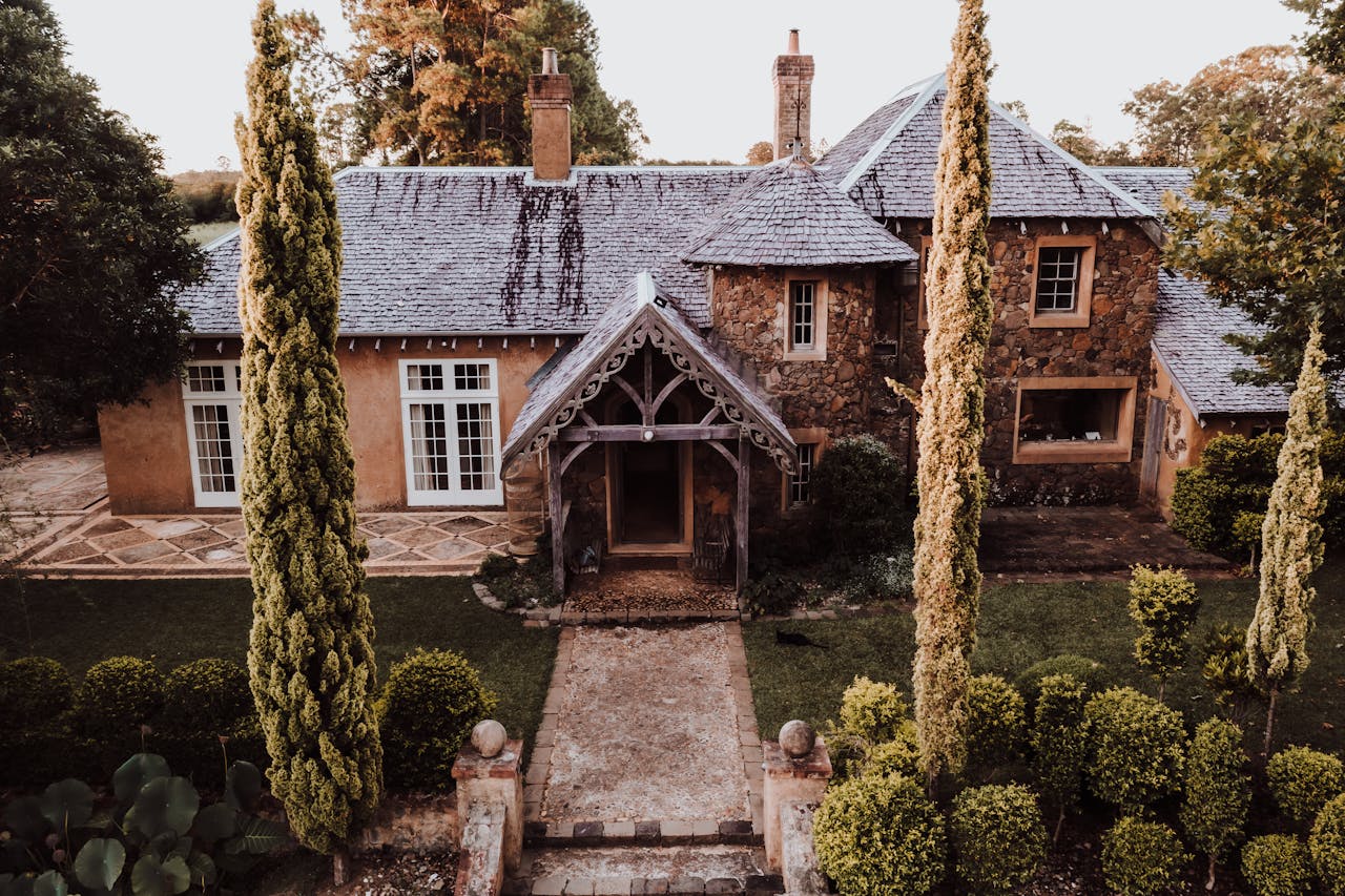 Charming stone manor with lush gardens in Byron Bay, Australia. A serene residential escape.